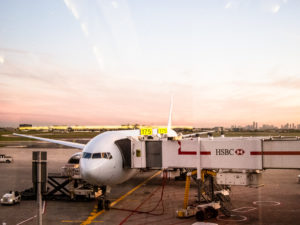 an airplane waits at the gate at an international airport