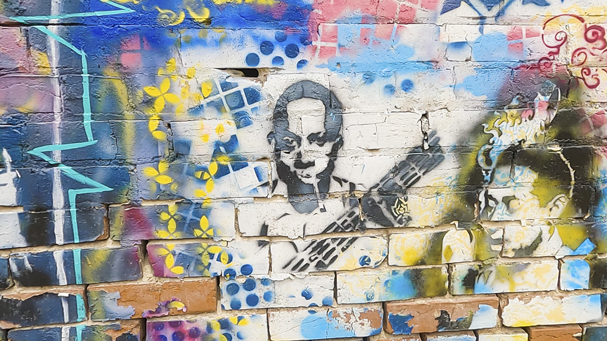 a colorful mural depicting Robert Johnson in Clarksdale, Mississippi, the birthplace of the blues